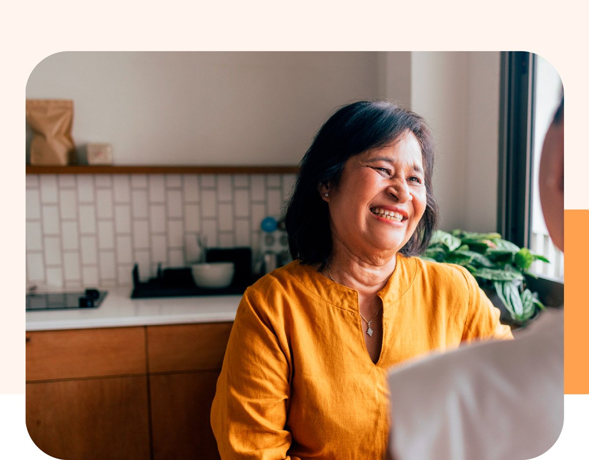 Smiling caregiver in yellow Smiling caregiver in yellow