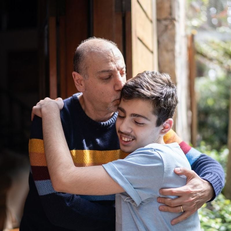 Father and son embracing